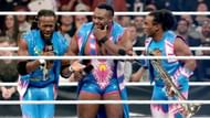 Kofi Kingston (left), Big E (center), and Xavier Woods (right)